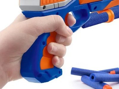 The gun being held, ready to fire